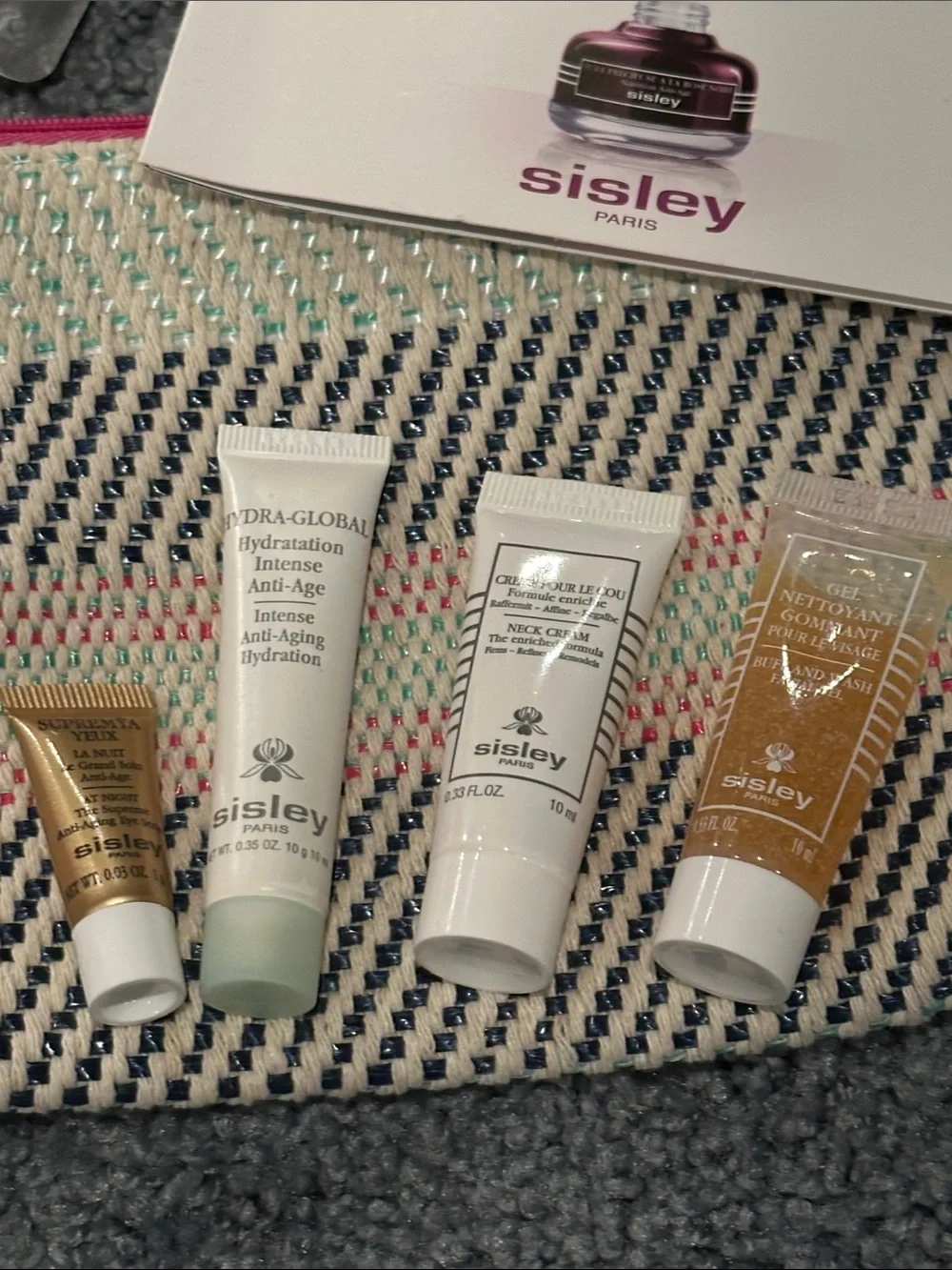 Sisley Travel Skincare Set with Pink, Black & Cream Woven Pouch